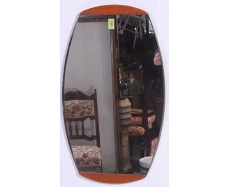 A vintage 1970's teak wood overmantel mirror of oval form together with a footstool on tapered ebonised legs. H39 x W66 cm 