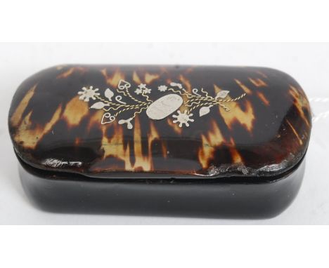 A papier mache and tortoiseshell silver inlaid snuff box with hinged top having decorative silver inlays W7cm