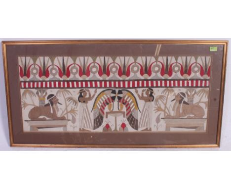 A 20th century Egyptian fabric embroidered tapestry panel being framed and glazed. Measures: 41x99
