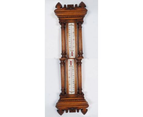 A good Victorian ceramic face aneroid banjo barometer. The oak case with blood thermometer gauge over ceramic barometer face 
