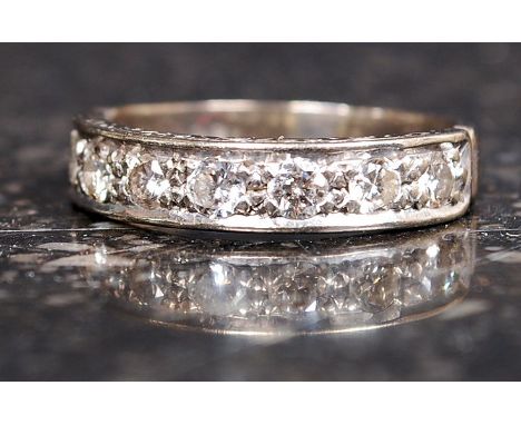 An 18ct gold and diamond ladies half eternity ring. The stones approx 5pnts each ( 7 stones total )