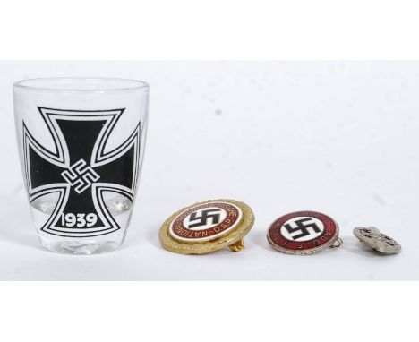 A collection of 20th century nazi memorabilia to include an enamel NSDAP badge being stamped to verso 9660Deschler & Sohn, an