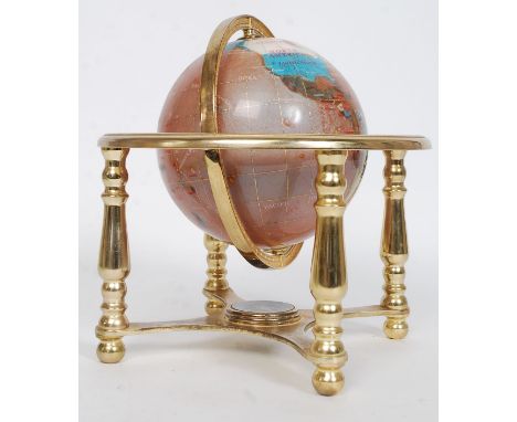 A semi precious stone inlaid celestial day and night globe on brass stand with inset compass. H18 cm 