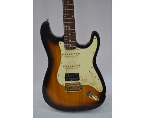 A two tone tobacco sunburst Tanglewood electric guitar.

UK, European & Worldwide packaging available on all lots. Please see
