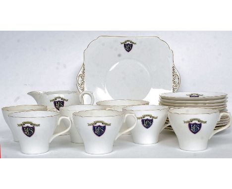 An unusual Shelley China part tea service comprising cups, saucers and plates etc. Each with coat of arms - crested monogram 