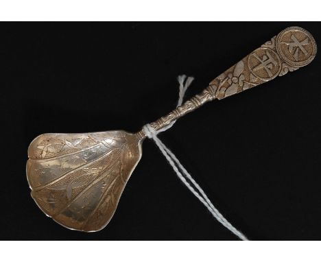 A Chinese silver caddy spoon having decorative shaped bowl with character marks to the handle. Unsigned, tests as silver. Tot