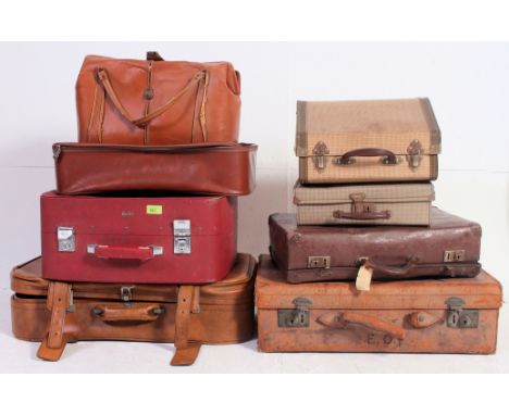 A collection of vintage suitcases dating from the 20th century to include various shapes and sizes. Measures: 19 x 65 x 45