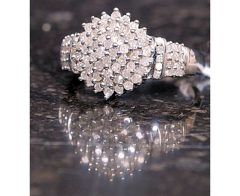 A 9ct white gold ladies cluster ring having approx 1ct of diamonds. Total weight 5.7g Size T