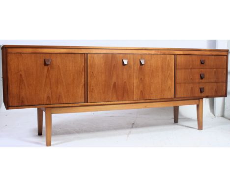 A good quality vintage mid 20th century teak sideboard in the Danish style having three drawers to right with central double 
