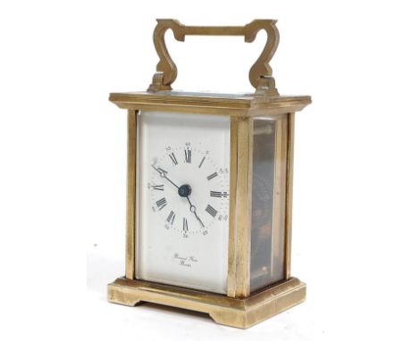 A good Bornand Freres brass carriage Clock  complete in the red leather travel case. The clock having white enamel dial with 