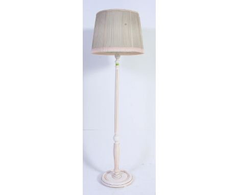 A 1930's Art Deco painted standard lamp. Reeded tapered stem on circular base with shade atop. Measures: 170 x 35.