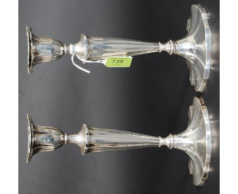 A pair of antique William Hutton & Sons hallmarked silver candlesticks, with splayed bases and ribbed fluted stems, with remo