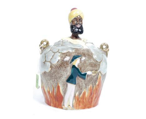 A vintage novelty mid 20th century ceramic biscuit barrel being adorned with a panto Aladdin and Genie top H26cm