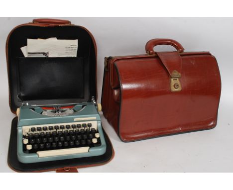 A vintage leather briefcase along with a cased portable Imperial typewriter
