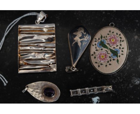 A collection  of silver 925 - sterling necklace pendants to include Siam silver, flower, amethyst stone set, contemporary and