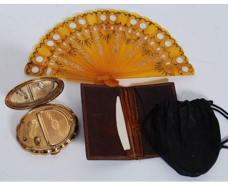 An unusual German Empire Coat of Arms (1889) leather wallet with embossed  centre together with a Minette ladies musical comp
