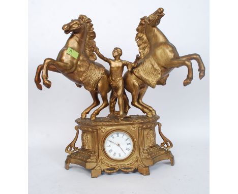 An antique French made gilt painted spelter topped mantel clock. With oversized figural group of wild horses to top. With ena