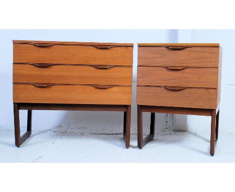 A vintage retro 1970's Europa teak wood chest of drawers raised on angled feet. Together with another similar chest with near
