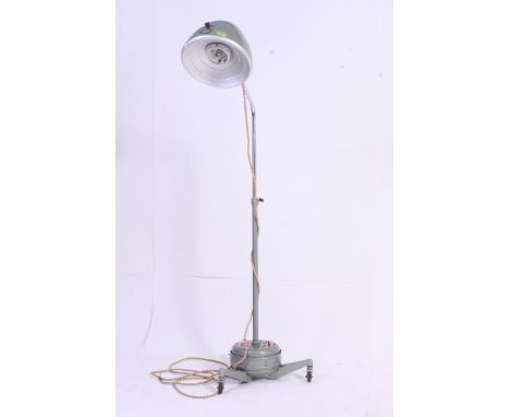 A vintage 1950's Hanovia dentists lamp on trolley with anglepoise stem having large enamel painted finish. Original retailers