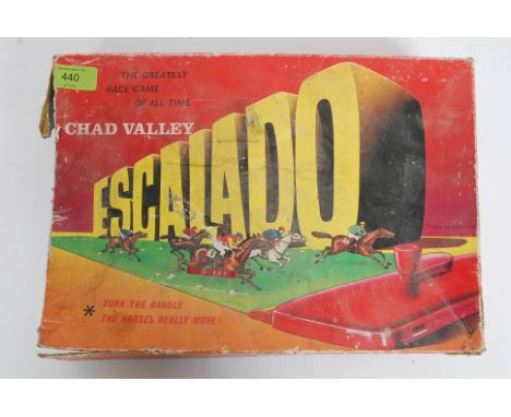 A vintage 20th century Chad Valley Escalado horse racing game with  diecast horses and jockeys etc in box 