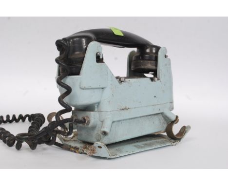 A vintage 20th century Industrial - believed military submarine telephone having central ring dial