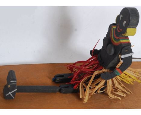 An Edwardian / early 20th century ' Tap Dancing Dinah ' lap puppet - within the original box, with Dinah and lap board. 