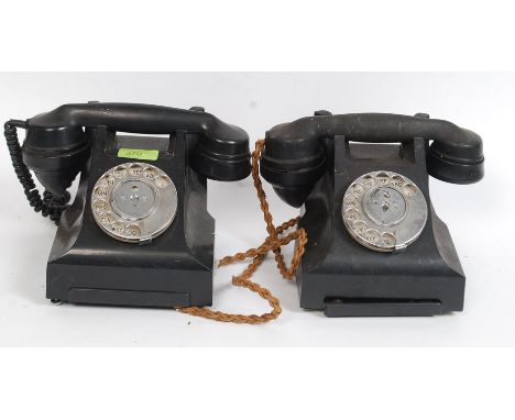 A pair of 1950's bakelite vintage telephones having ring dial and undertrays marked 332L & 332 G3