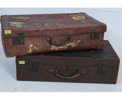 2 vintage 20th century gentlemans suitcases, one being canvas, the other faux brown leather, both with handles and clasps etc