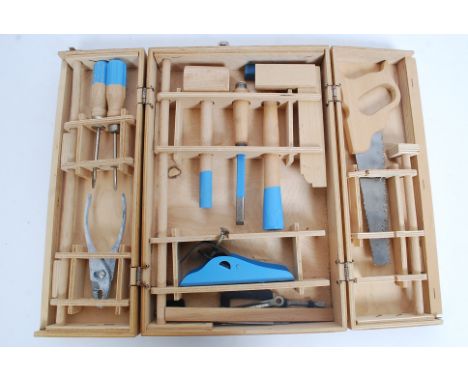 A vintage childs cased carpentry / wood working set, to include saw, hammer, measures etc tools for wood working 37cm long