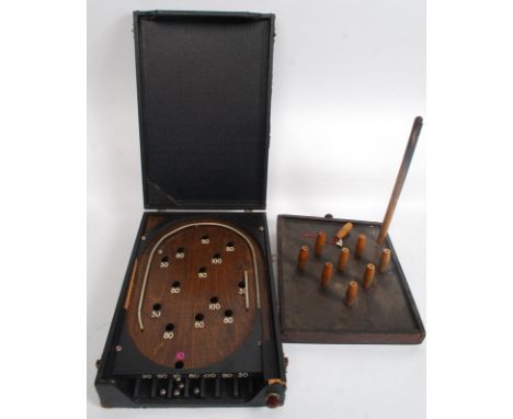 A good 1930's pinball bagatelle game, within the original case, along with a table skittles set. 