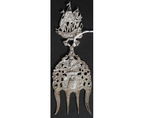 A Silver tested Dutch 19th century serving fork, bearing coat of arms under crown, below a Dutch galleon 59.7g. L19 cm 