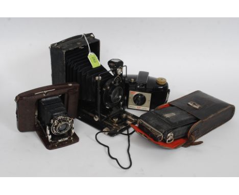 A  vintage Russian ROM 3 bellows camera together with a Nettar folding portable bellows camera in leather case, a portable ba