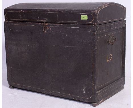 A Victorian ebonised Isle of Man Swastika decorated dome top trunk. The interior lined with old newspapers, carry handles to 