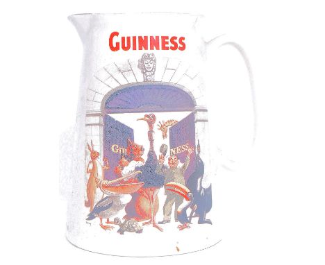 A vintage advertising jug for Guinness, having a all the Guinness animals in a comical scene, stamped to base Goldprint H23cm