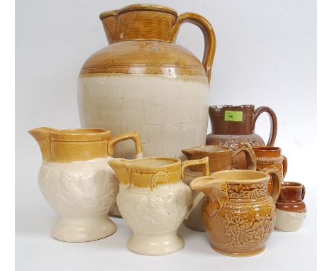 A collection of stoneware ceramics to include hunting scene jugs, saltglaze and a large Hawley of Bristol stoneware flagon wi