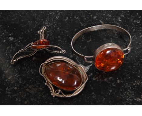 A 3 piece art nouveau silver and amber style inset jewellery combination. Bracelet, brooch and bangle. Total weight 48.0g