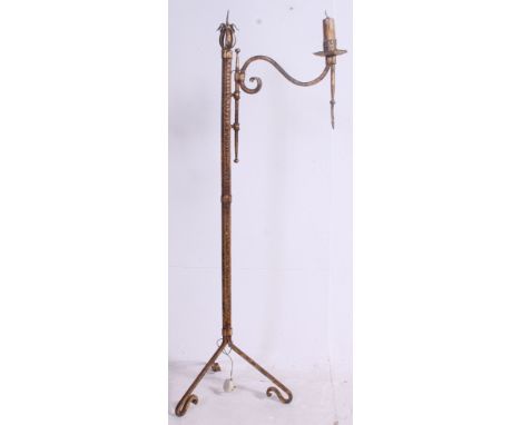 An unusual 20th century cast iron gilt painted candlestick adjustable lamp standard. Raised on rococo tripod base  Measures: 