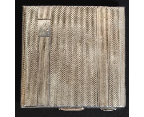 A hallmarked silver ladies makeup compact, with chase engraving to exterior. H7cm.; 91.3g