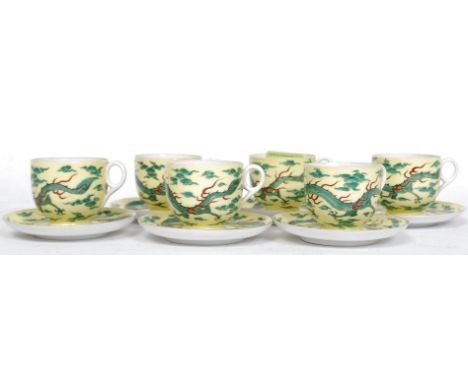 A Japanese decorative famille Juane tea service to include cups, saucers etc. The yellow ground decorated with 4 claw dragons