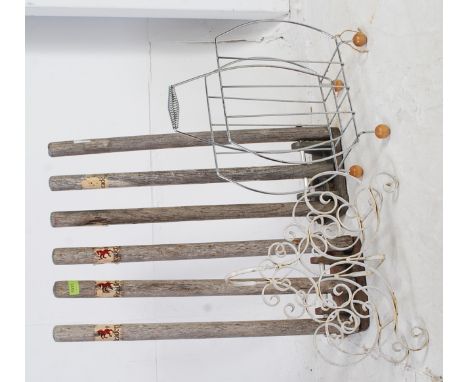 A pair of vintage wooden cricket training stumps together with a retro 1970's chrome magazine rack and another. Measures: 71 