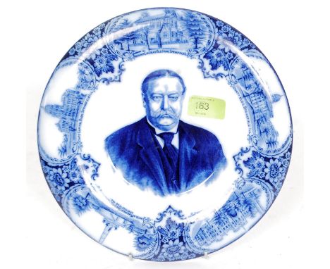 A Wedgwood  & Co flo blue plate with portrait of American President William Howard Taft. The borders set with scenes of Sprin