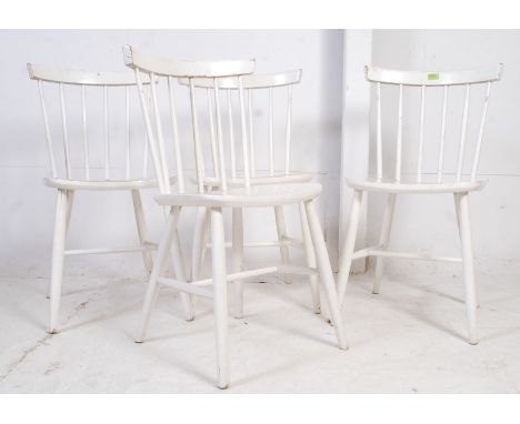 A set of 4 20th century painted Habitat style Windsor kitchen chairs. Raised on turned legs united by stretchers having panel