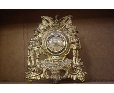 A 20th Century gilt metal mantel clock, 28m high 
