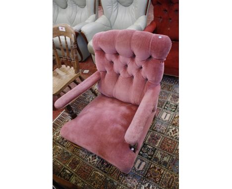 A pair of Victorian armchairs, with button upholstered back and open arms on turned legs - in differing upholstery - together