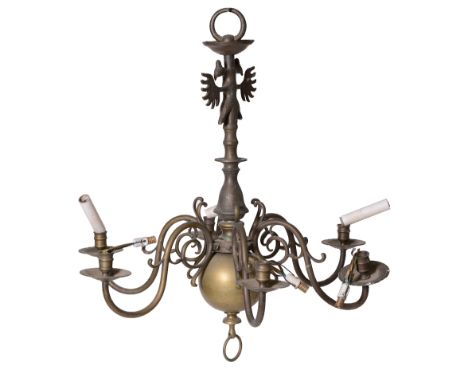 A pair of brass eight light chandeliers in late 17th century style, late 19th / early 20th century, each with sockets on dish