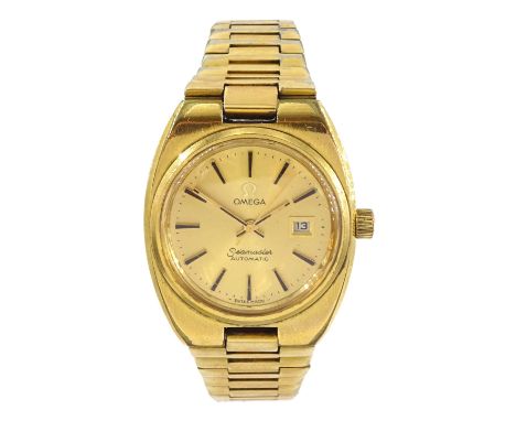 Omega Seamaster ladies gold-plated and stainless steel automatic wristwatch, champagne dial with baton hour markers and date 