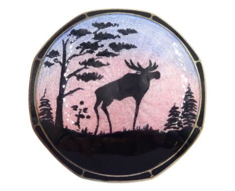 Norwegian silver and guilloche enamel brooch by Askel Holmsen, depicting a moose and trees silhouetted against a blue pink gu