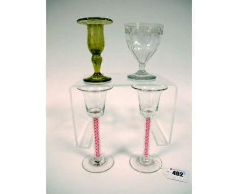 A Pair of XIX Century Wine Glasses, the bell shaped bowls raised on red and white enamel twist stems and circular feet, 15.5c