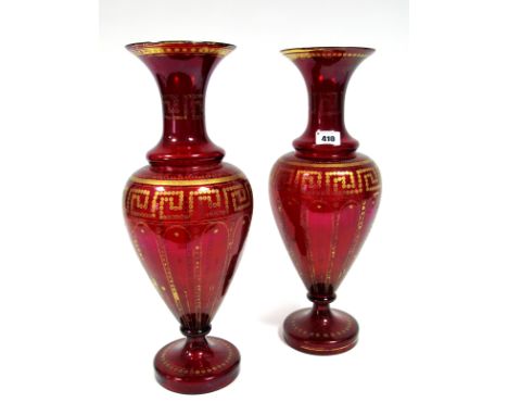 A Pair of XIX Century Ruby Glass Vases, of baluster faceted form, decorated within dot and key pattern borders, 41cm high. (2
