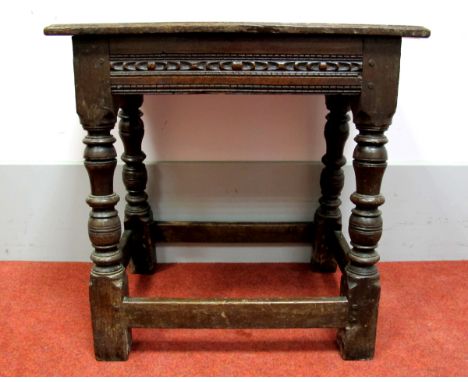 A XVII Century and Later Joined Oak Stool, with rectangular top, carved frieze, on turned and block supports united by stretc